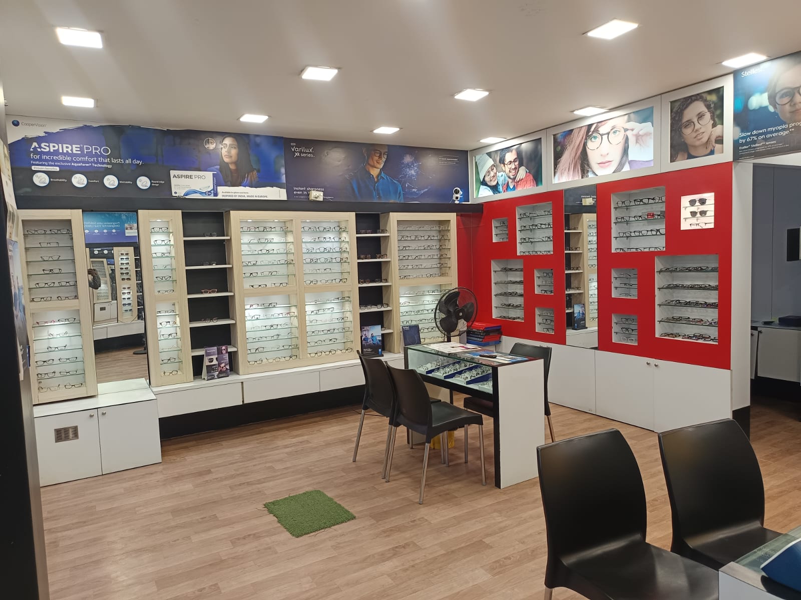 Vision Plus Optics Estancia Thailavaram showroom interior frames display